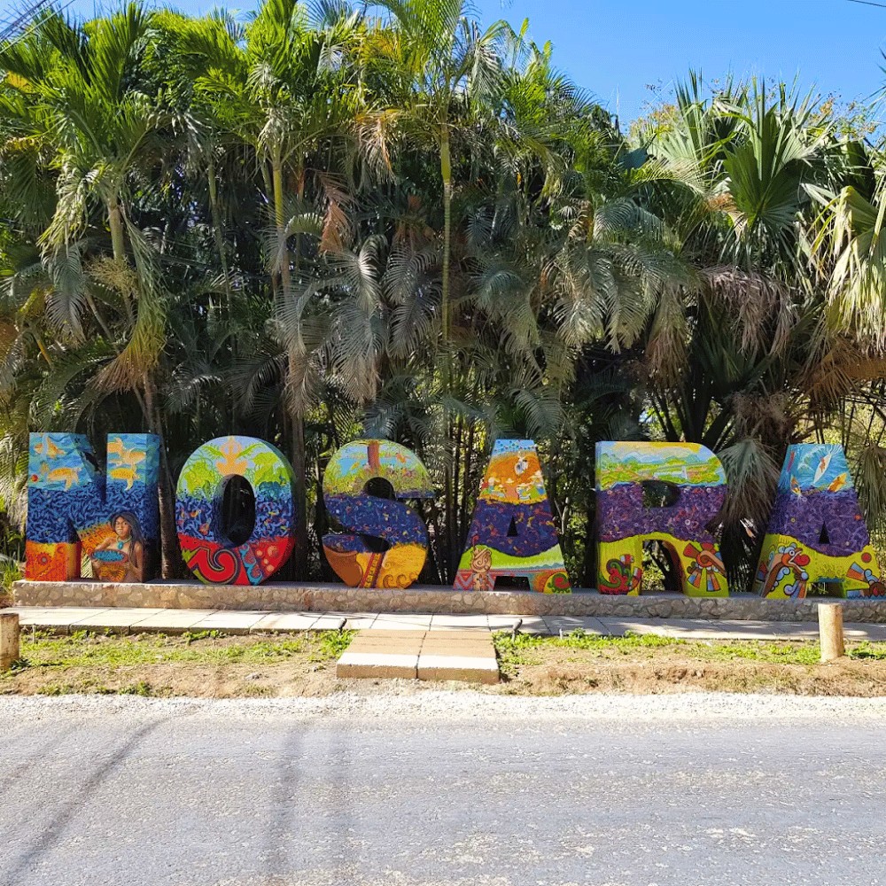 Colorful Nosara sign in the jungle