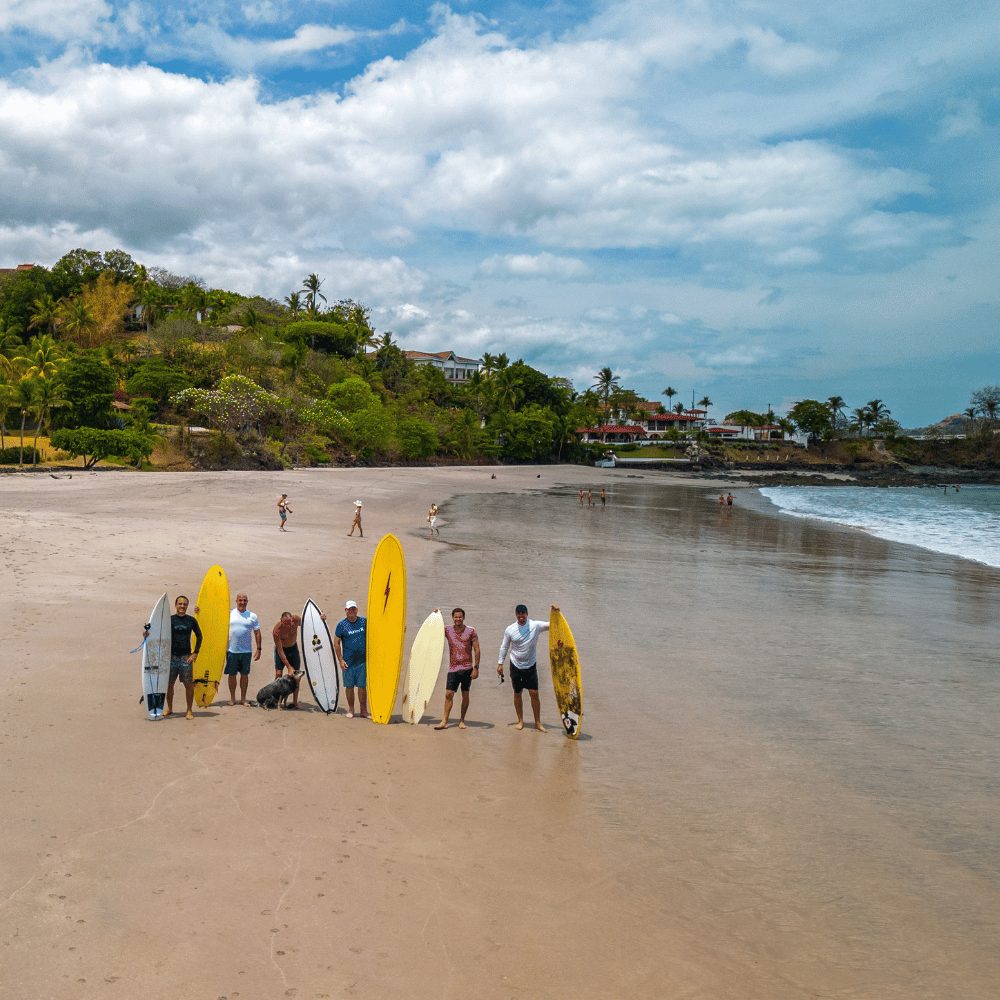 Surfers on the beach at Playa Guiones